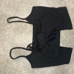 Black crop top that is open in the front.